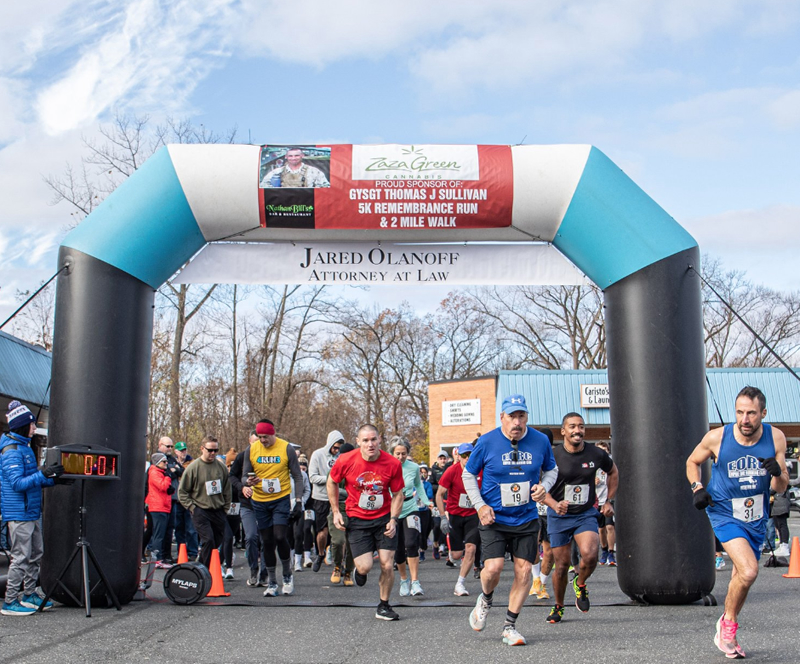 Neighbors participating in a community walk and fun run in East Forest Park